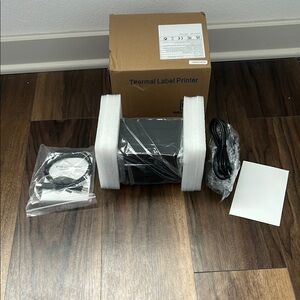 Thermal Label Printer with Roll of Labels.